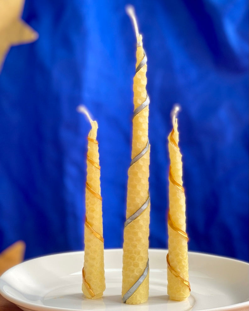 three spiral hand-rolled candles using Beeswax Candle Sheets and decorated with Metallic Modelling Beeswax Sheets