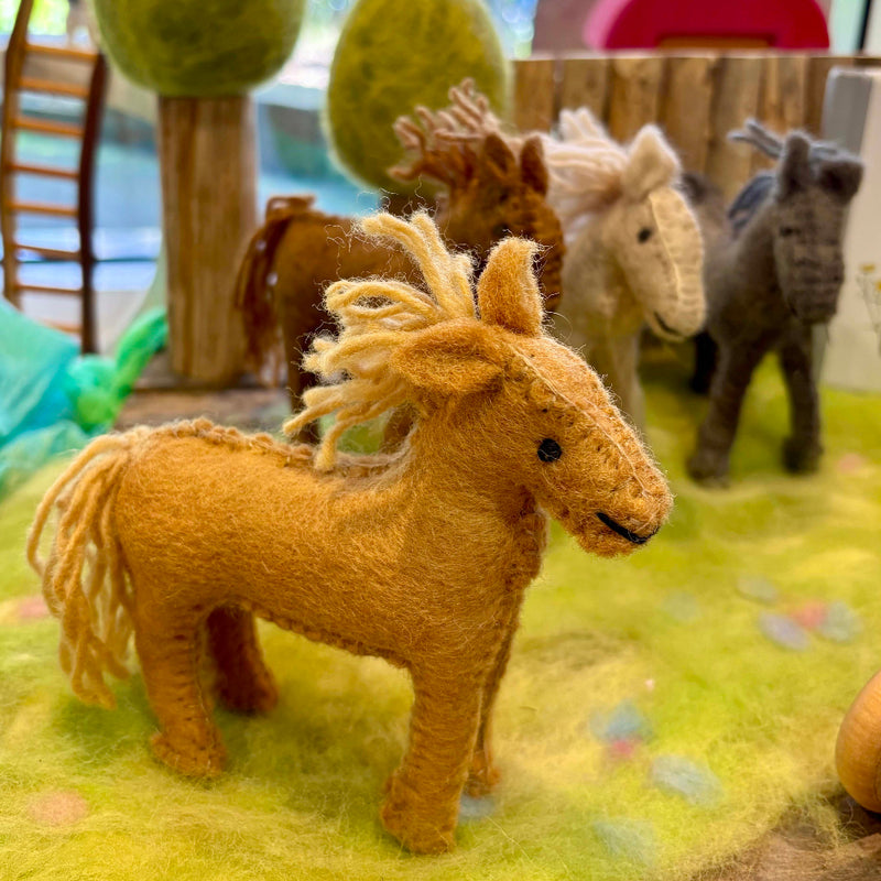Handmade Felt Barn Horse Toy in play scene