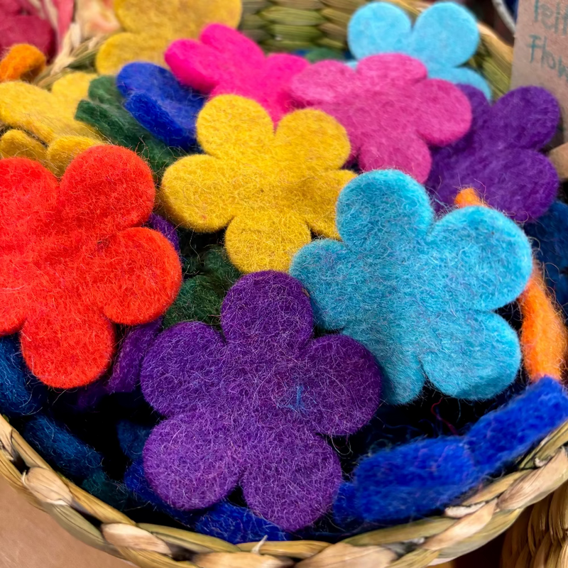 Basket of colorful felt die-cut flowers with a blurred background