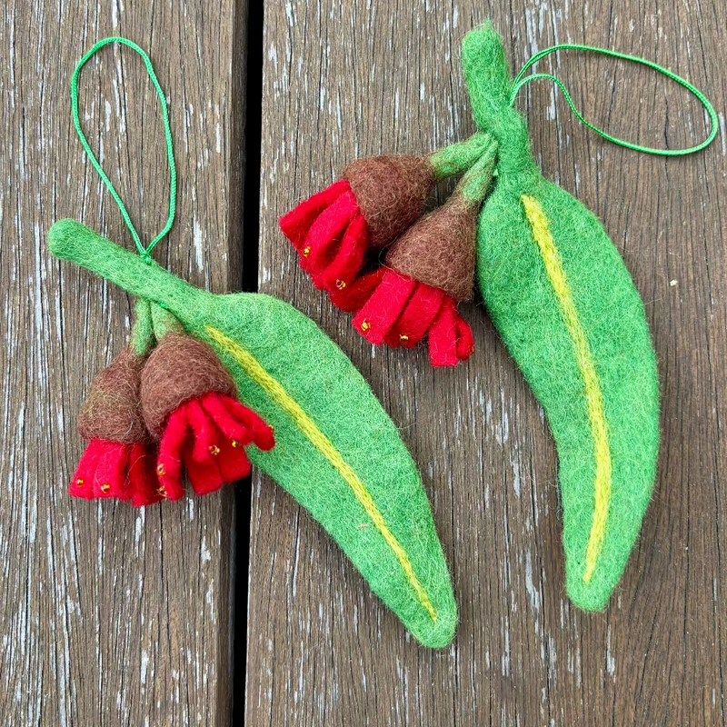Felt Gum Flower ornaments on a wooden surface
