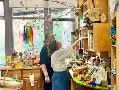 Owner Taryn helping a customer inside Grassroots Eco Store