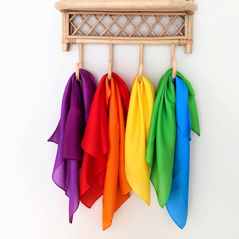 Play Silkies, Mini Silk Playcloths hanging on display hooks
